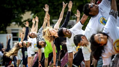 Participants take part in a mass yoga event, to celebrate the International Yoga Day, in Amsterdam, The Netherlands. Remko de Waal / EPA