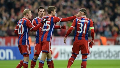 At right, Bayern Munich's Bastian Schweinsteiger is congratulated by Thomas Muller, to his left, after scoring in Bayern's 3-0 win over CSKA Moscow in the Champions League on Wednesday at the Allianz Arena in Munich. Christof Stache / AFP