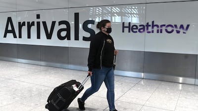 A passenger wearing a face mask arrives at Heathrow airport in London. If current barriers to travel are replaced with effective testing programmes, 31 million jobs could be saved by the end of 2020, the WTTC said on Friday. AFP