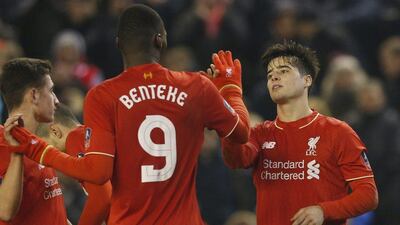 Liverpool’s Joao Carlos Teixeira celebrates scoring with Christian Benteke on Wednesday night in the FA Cup at Anfield. Phil Noble / Reuters