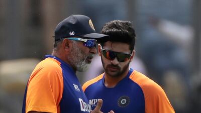 Indian bowling coach Bharat Arun, left, speaks with Shardul Thakur during a training session in Pune on Monday. AP