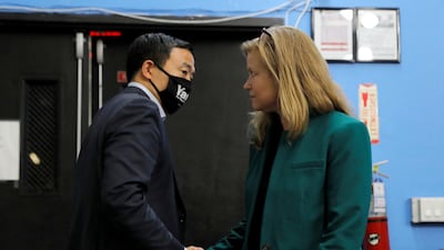 New York City mayoral candidates Andrew Yang and Kathryn Garcia shake hands at a mayoral forum Harlem. Reuters