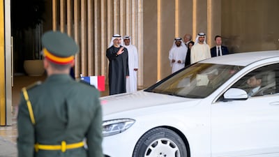 Sheikh Khaled bin Mohamed bids Emmanuel Macron farewell at the Presidential Airport. Omar Al Askar / UAE Presidential Court