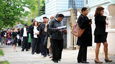 Job hunters wait in line at an employment fair in New York. The US jobless rate is about 7.7 per cent. Stan Honda / AFP