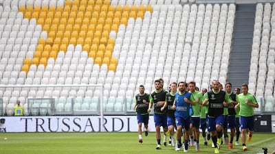 Juventus players jog during a team training session on Monday at the Juventus Stadium in Turin ahead of the Champions League final. Marco Bertorello / AFP
