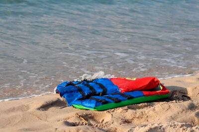 Life jackets littering the beach off the coast of Libya near the port of al-Khums, a poignant symbol of the catastrophic loss of life. AP