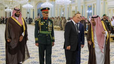 Prince Mohammed bin Salman, Saudi Brigadier General Yussef Saleh Al Salim, second left, Mr Putin and King Salman during a welcome ceremony. AFP
