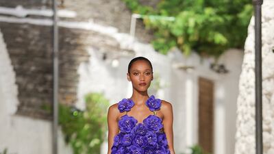 The collection featured flowing gowns and sheer dresses, worn with sandals