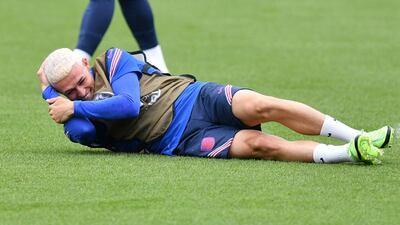 Phil Foden gestures after getting hit in the face during training. AFP