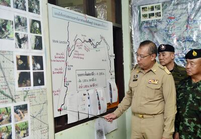 Narongsak Osottanakorn, Commander of the Joint Administration Centre for Rescue Operations at Tham Luang Cave, briefing Thai Prime Minister Prayut Chan-o-cha on the rescue operation. EPA