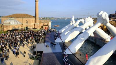 Lorenzo Quinn’s ‘Building Bridges’ sculpture at the Venice Biennale, which has postponed its exhibitions. Getty Images