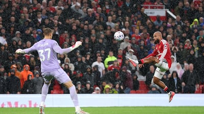 Bryan Mbeumo lobs home Manchester United’s fifth goal. Getty Images