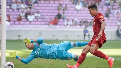 Firmino goes close to finding the net as the ball hits the post. AFP