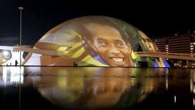 An image of the Brazilian soccer player Ronaldinho is projected onto Brasilia's National Museum. Ueslei Marcelino / Reuters