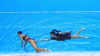 USA coach Andrea Fuentes swimming to recover USA's Anita Alvarez from the bottom of the pool during an incident during the Budapest 2022 World Aquatics Championships. Taken by Oli Scarff. AFP/PA