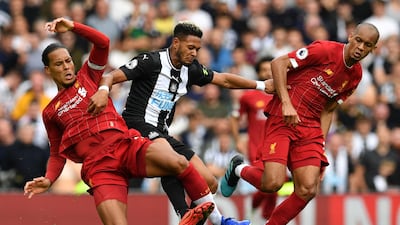 Liverpool's Dutch defender Virgil van Dijk tackleS Newcastle United's Brazilian striker Joelinton. AFP