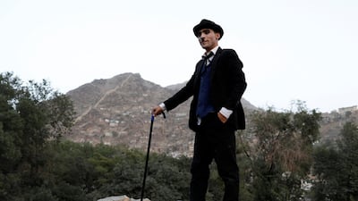 Karim Asir poses for a picture after a performance in Kabul Zoo. Reuters