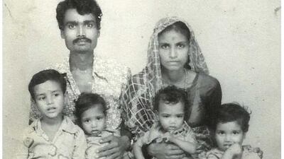 In a combination picture Lata Bai, top right, is seen with her husband Ashok Badgujjar and their four sons in an undated family photograph, top, and, bottom, Lata Bai, top right, is seen with her four sons in Bhopal November 12, 2014. Bai said that Badgujjar died as a result of gas poisoning after the 1984 Bhopal disaster.