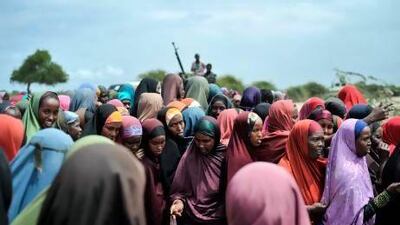 Displaced women lining up at a food distribution centre in Afgoye, Somalia where the UAE Red Crescent was giving out food aid as part of a Ramadan programme. Handout from African Union-United Nations Information Support Team