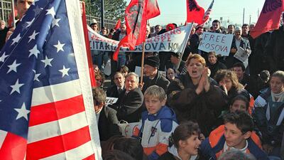 Hundreds of ethnic Albanians from the Serbian province of Kosovo protest against the inclusion of Serbia and its president Slobodan Milosevic in the peace talks between Bosnia, Croatia and Serbia, at the gate near the site of the talks 19 November 1995 at Wright Patterson Air Force Base near Dayton, Ohio. AFP