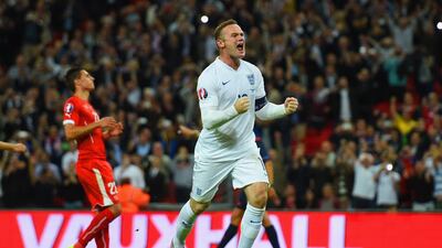 Wayne Rooney celebrates his record-setting 50th international goal for England on Tuesday at Wembley in a Euro 2016 qualifying win over Switzerland. Shaun Botterill / Getty Images