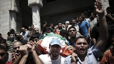 Relatives of 27-year-old Widad Deif, the wife of Hamas's military commander Mohammed Deif, carries her body during her funeral procession in the northern Gaza Strip on August 20. AFP