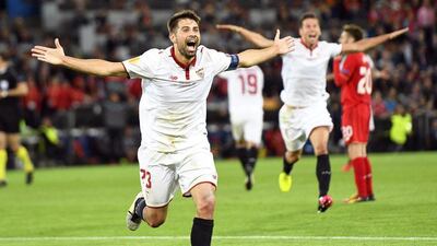 Sevilla captain Coke celebrates his second goal and Sevilla’s third in a 3-1 win over Liverpool. Jean-Christophe Bott / EPA