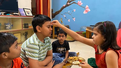 Girls commonly put vermilion paste on their brother's forehead. AP