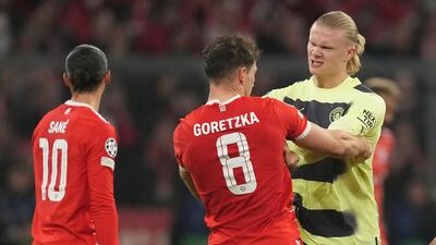 Manchester City's Erling Haaland scuffles with Bayern's Leon Goretzka. AP