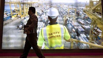 A man walks past the DP World display at the World Ports and Trade Summit in Abu Dhabi yesterday. Christopher Pike / The National