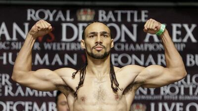 FILE - In this Dec. 12, 2014 file photo, Keith Thurman poses on a scale during a weigh-in, in Las Vegas. Thurman and Shawn Porter will meet Saturday night, June 25, 2016, at Barclays Center, in Brooklyn, N.Y., for Thurman's WBA welterweight title. (AP Photo/John Locher, File)