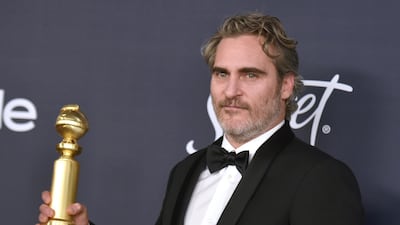 Joaquin Phoenix poses with his award for award for Best Performance by an Actor in a Motion Picture - Drama for his role in 'Joker', during the 77th annual Golden Globe Awards on January 5, 2020, at The Beverly Hilton hotel in Beverly Hills, California. AP