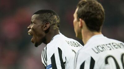 Paul Pogba (L) of Juventus jubilates after scoring the 0-1 goal during the Uefa Champions League Round of 16 second leg match between Bayern Munich and Juventus, in Munich, Germany, 16 March 2016. EPA/SVEN HOPPE