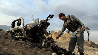 Afghan security forces check the site a day after an an attack claimed by the Taliban near the Bagram Air Base, north of Kabul, Afghanistan, Tuesday, April 9, 2019. AP Photo