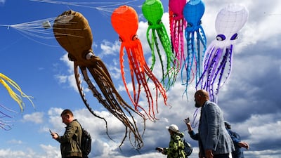 Kites fly in the sky during the Kite Show at Fort Konstantin in city of Kronstadt outside Saint Petersburg, Russia. AFP