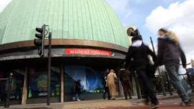 Visitors walk past the outside of Madame Tussaud's waxworks museum in London, bought by Dubai Holding in 2005, though most was later sold to Blackstone Group.