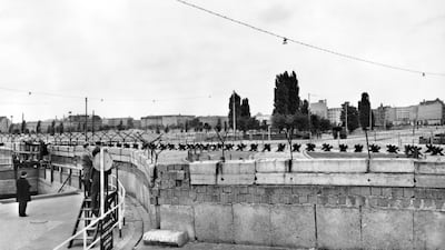 Taken at the Potsdamer Platz, this image shows the Berlin wall built by the East German government to seal off East Berlin from the part of the city occupied by the three main western powers (USA, Great Britain and France), and to prevent mass illegal emi???