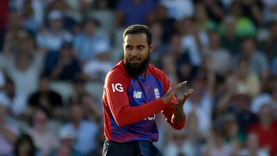 England's Adil Rashid celebrates the dismissal of Pakistan's Shadab Khan during the third T20 international at Old Trafford in Manchester on Tuesday. AP