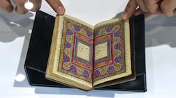 A miniature Quran manuscript, produced in the Islamic Hijri year 1286 AH, is at the Peter Harrington stand at Abu Dhabi book fair. Victor Besa / The National