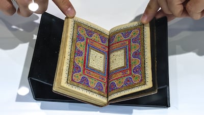 A miniature Quran manuscript, produced in the Islamic Hijri year 1286 AH, is at the Peter Harrington stand at Abu Dhabi book fair. Victor Besa / The National
