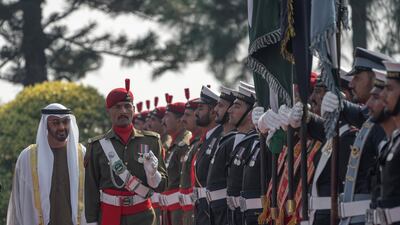 ISLAMABAD, PAKISTAN - January 06, 2019: HH Sheikh Mohamed bin Zayed Al Nahyan, Crown Prince of Abu Dhabi and Deputy Supreme Commander of the UAE Armed Forces (back L), inspects honor guard during a reception at the Prime Minister's residence. ( Mohammed Al Hammadi / Ministry of Presidential Affairs ) ---