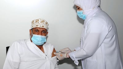 An Omani man receives a dose of the Pfizer/BioNTech Covid-19 vaccine in Oman's capital Muscat. AFP