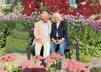 Prince Charles and Camilla shared their Christmas card, which was taken in the garden of their private residence in Scotland. Instagram / Clarence House