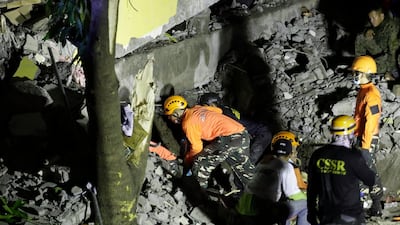 Emergency staff wrok through the night looking for survivors. EPA