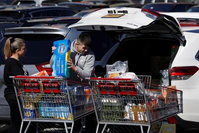 People load Clorox into their car in a Costco parking lot after the first confirmed case of coronavirus was announced in New York on Monday. The Clorox Company, which is listed on the New York Stock Exchange, is expected to see demand rise. Photo: Reuters
