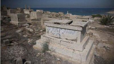 A tomb with the words 'Death to Arabs' written in Hebrew on it in a Muslim cemetery in Jaffa, outside Tel Aviv. Vandals defaced various graves on a Muslim and Christian graveyard over Yom Kippur. OLIVER WEIKEN / EPA