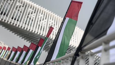 UAE Flags line the new extension of the creek by the Al Wasl Road bridge in Jumeirah. Antonie Robertson / The National