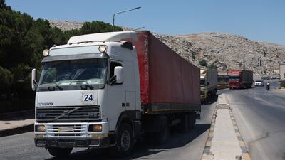 A convoy carrying humanitarian aid arrives in Syria through the Bab Al Hawa border crossing with Turkey. AFP