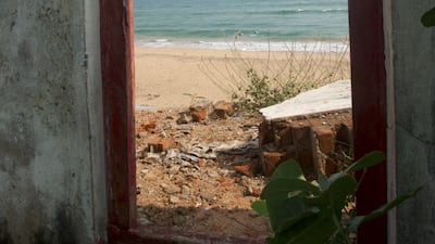 Name plates still hang outside the neatly painted entrances; inside tattered clothes and slippers strewn on the floor—a remnant of their former owners—with walls still adorned with beautiful hand painted vines.