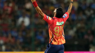 Punjab Kings' Harpreet Brar celebrates the dismissal of Royal Challengers Bengaluru's Glenn Maxwell. AP